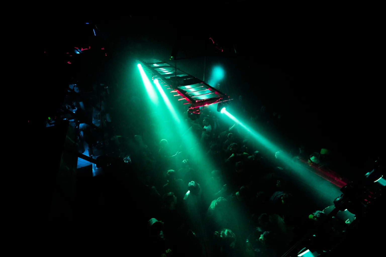 Dance floor beneath green spotlights at Project Kulture.