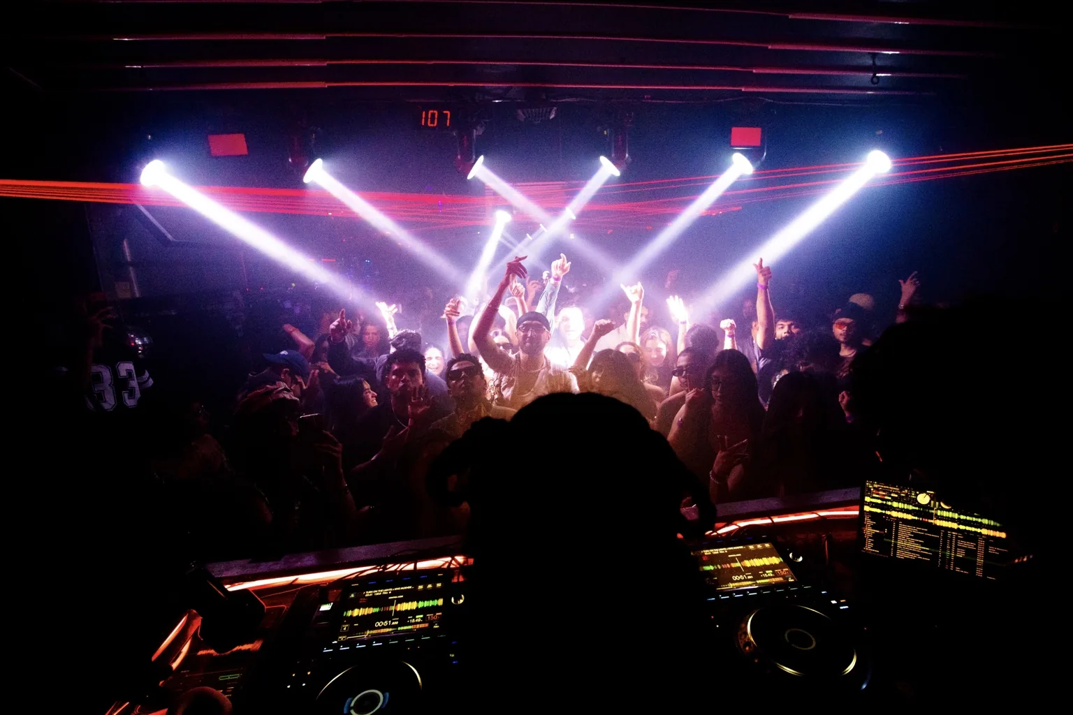 View from the DJ booth toward a brightly lit dance floor at Project Kulture.