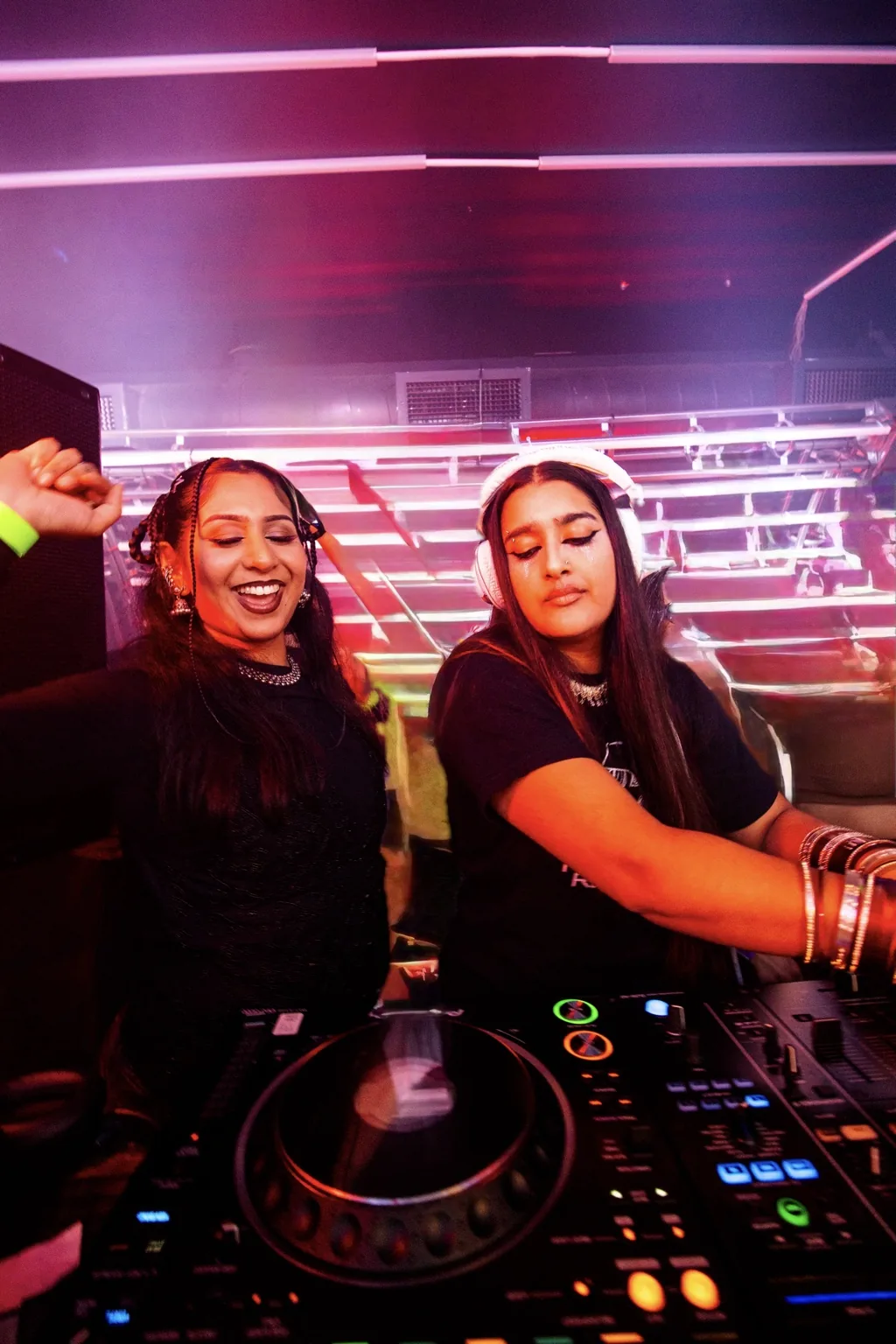 Two DJs performing together at the mixer at Project Kulture.