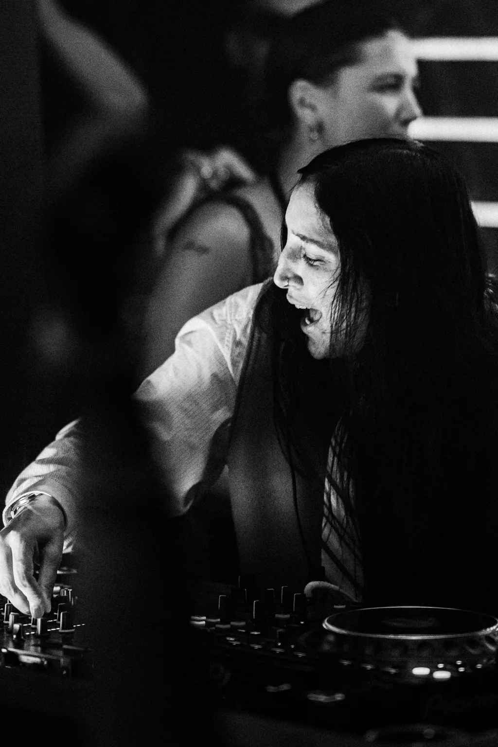 Black and white photo of a guest beside the booth at Project Kulture.