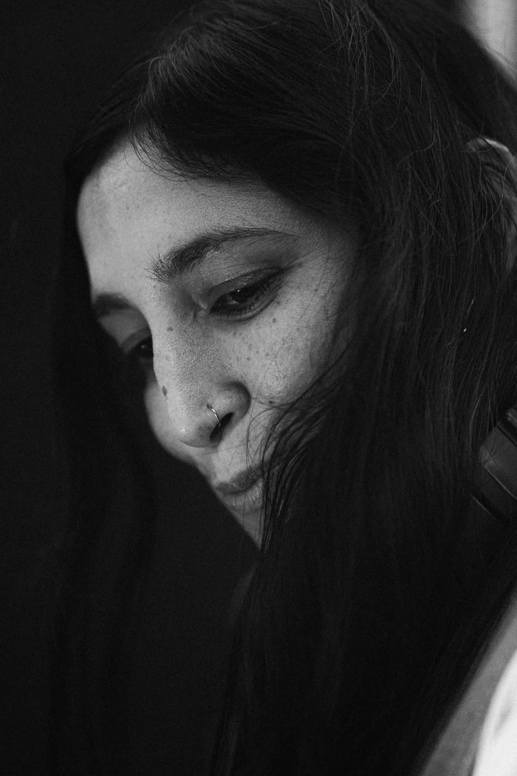 Black and white portrait of a smiling guest at Project Kulture.