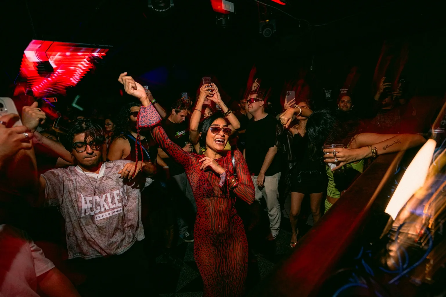 Crowd cheering toward the DJ booth at Project Kulture.